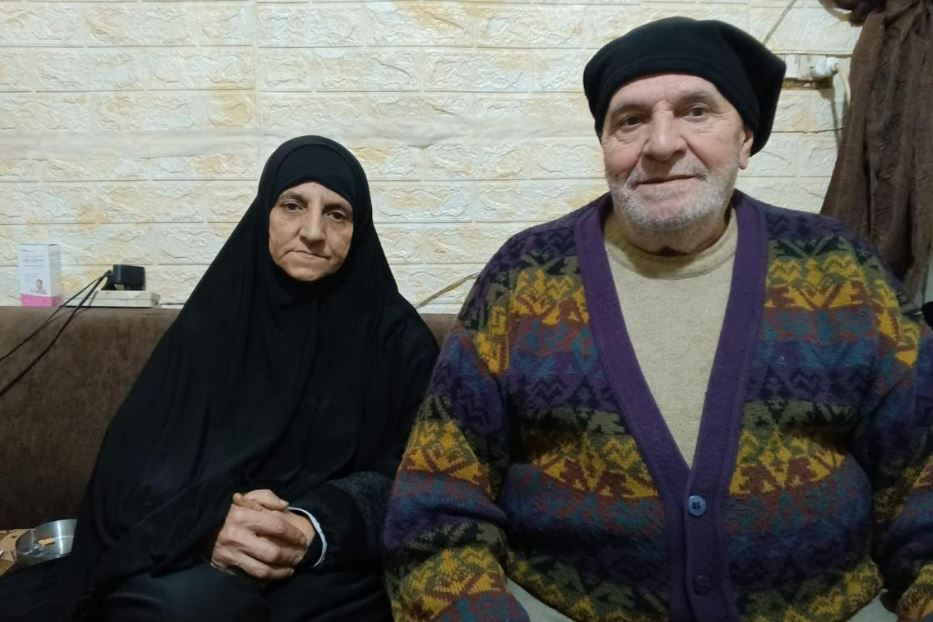 Ahlam and her husband in their home in Tripoli - .
